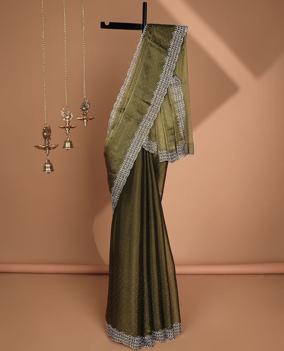 Green all-over stone work burburry chiffion saree with self cutthana stone work border