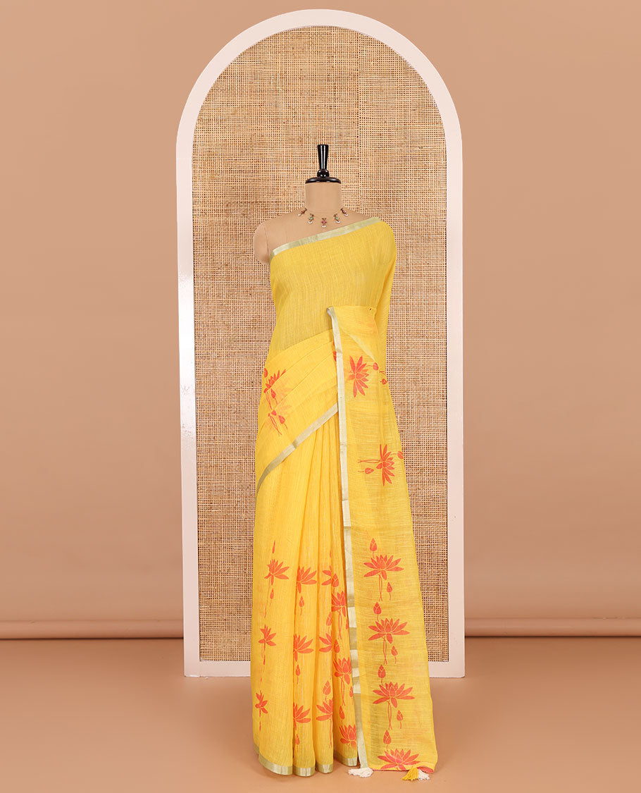 Yellow Pichwai lotus printed linen cotton saree, piping zari border, colorful tasselled lotus printed pallu, and a contrast lotus printed blouse
