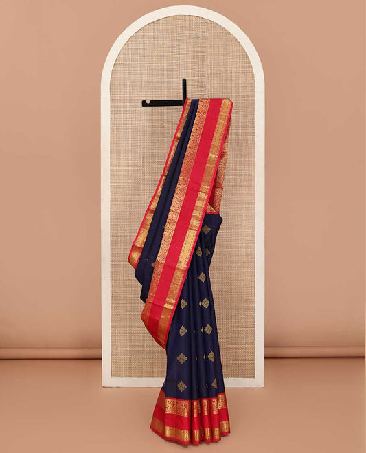 Navy blue zari buttas silk saree, contrast rettai pettu border of kodi visiry, paisa, and rudraksham motifs and pallu of jaal design