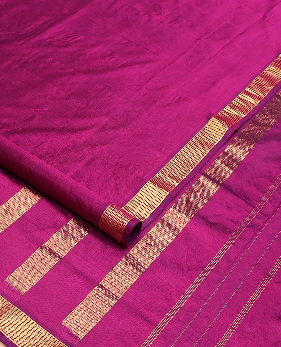 Magenta plain nine-yard silk saree, zari border, and pallu of zari designs