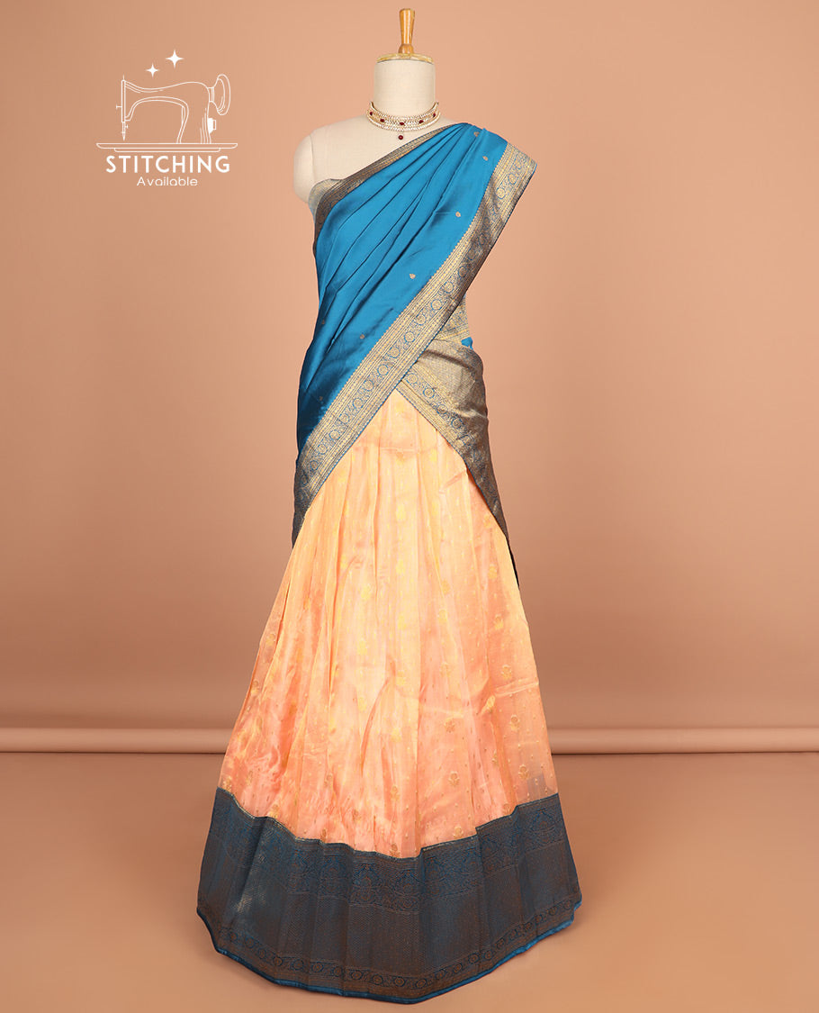 orange half saree with contrast zari design border, zari design blouse & floral zari design dhavani