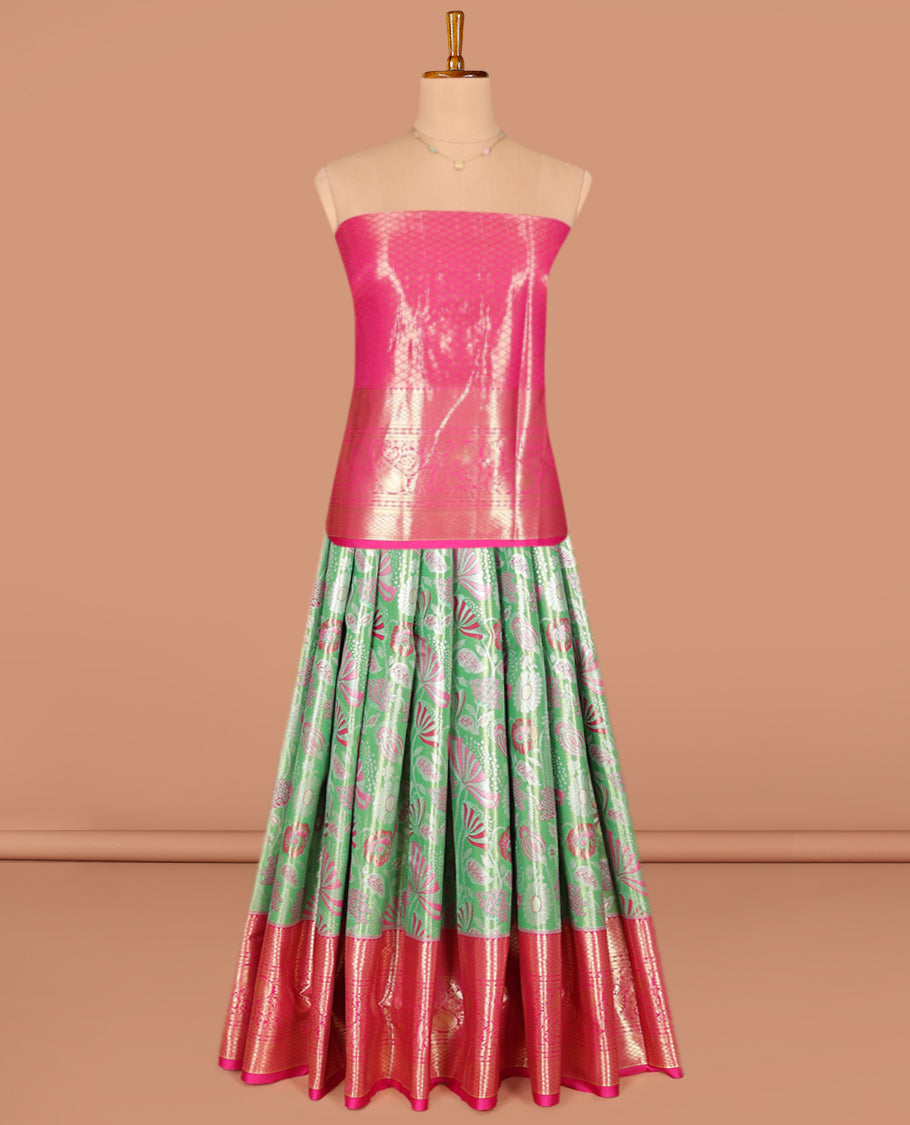 Green Art Silk Pavadai Material Set, Opulently Embellished with Jacquard Designs on Its Skirt, Complemented by a Contrast Traditional Zari Designs Woven Border, and Paired with a Contrast Jacquard Blouse