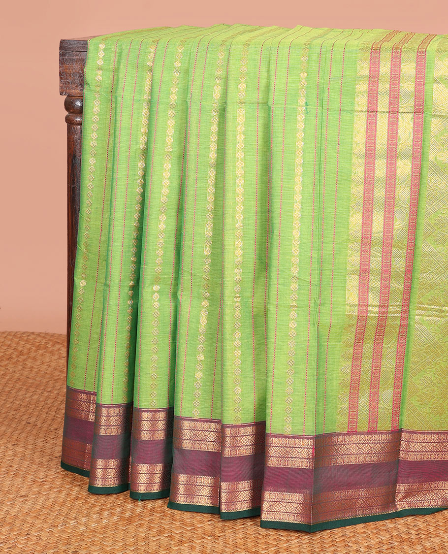 Green Chettinad Cotton Saree Delicately Woven with Buttas on Its Body, Complemented by a Contrast Traditional Zari Design Woven Rettai Pettu Border, and Elegantly Highlighted Pallu
