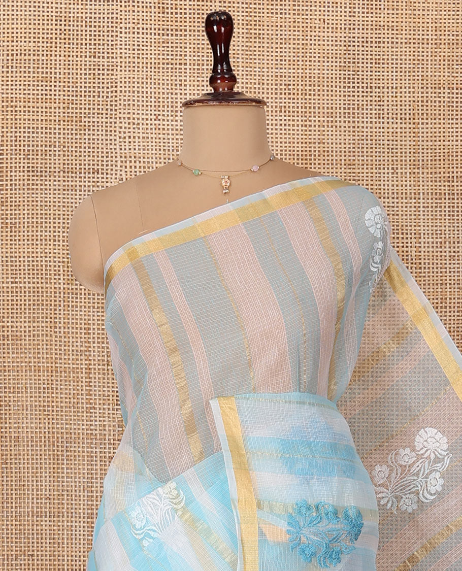 White and Blue Kota Cotton Saree, Mesmerized with Stripes and Floral Motifs Thread Embroidery on Its Body, Piping Border, Pallu Features Floral Embroidery, and Paired with a Matching Blouse