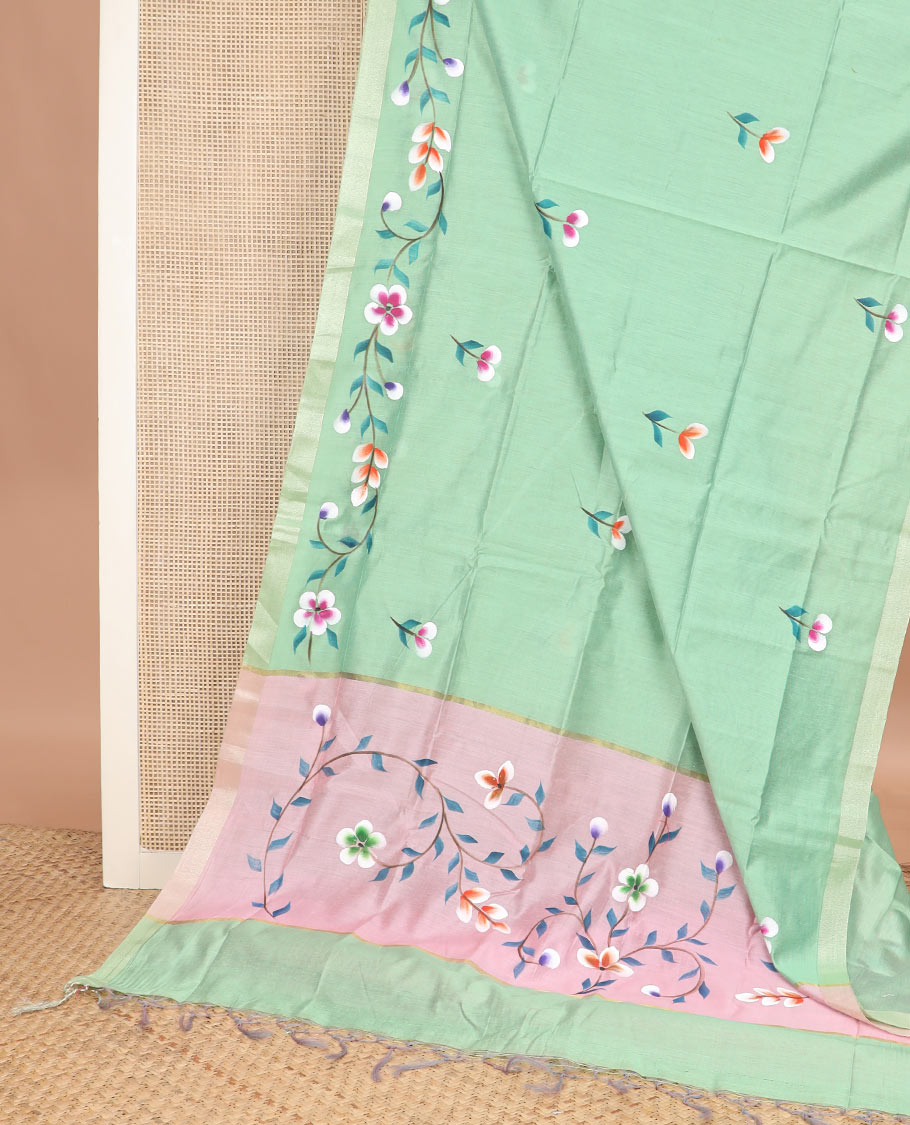 Green colorful floral motifs printed jute cotton saree, bavanji border, and contrast floral vine printed pallu