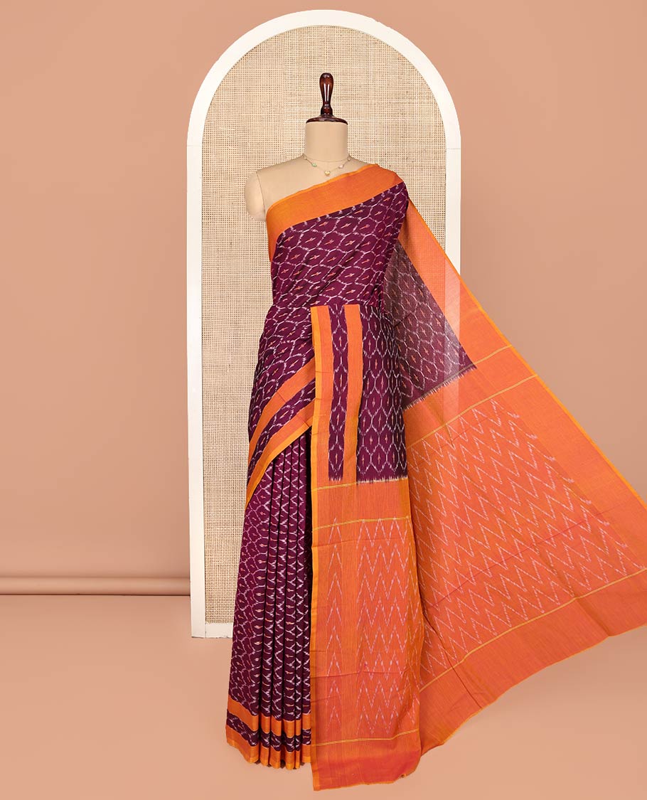 Maroon Ikkat Cotton Saree, Decked Up with Ikkat-Style Ogee Patterns on Its Body, Complemented by Contrast Border, Pallu of Chevron Designs, and Has No Blouse