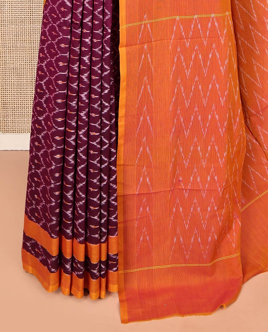 Maroon Ikkat Cotton Saree, Decked Up with Ikkat-Style Ogee Patterns on Its Body, Complemented by Contrast Border, Pallu of Chevron Designs, and Has No Blouse