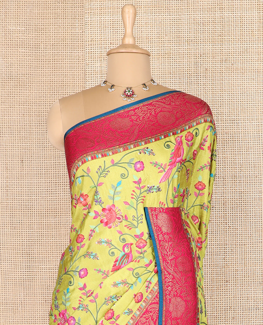 Green colorful floral vine and bird digital printed dola silk saree, contrast floral zari border, and meenakari paisleys pallu