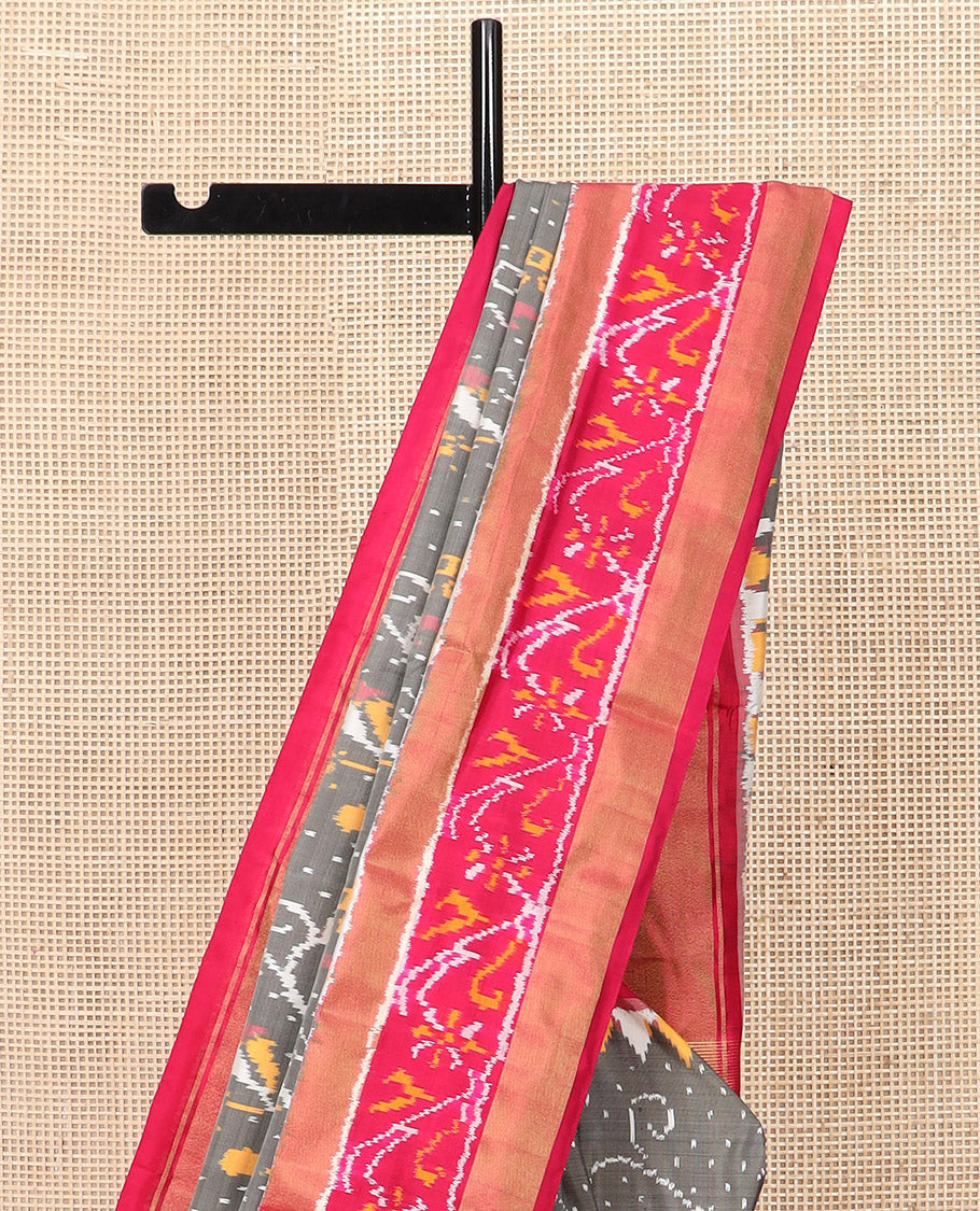 Grey Ikkat Silk Saree Decked Up with Elephant Motifs in Ikkat Weave, Complemented by a Contrast Temple Border, Pallu Woven in Intricate Ikkat Designs, and a Contrast Blouse