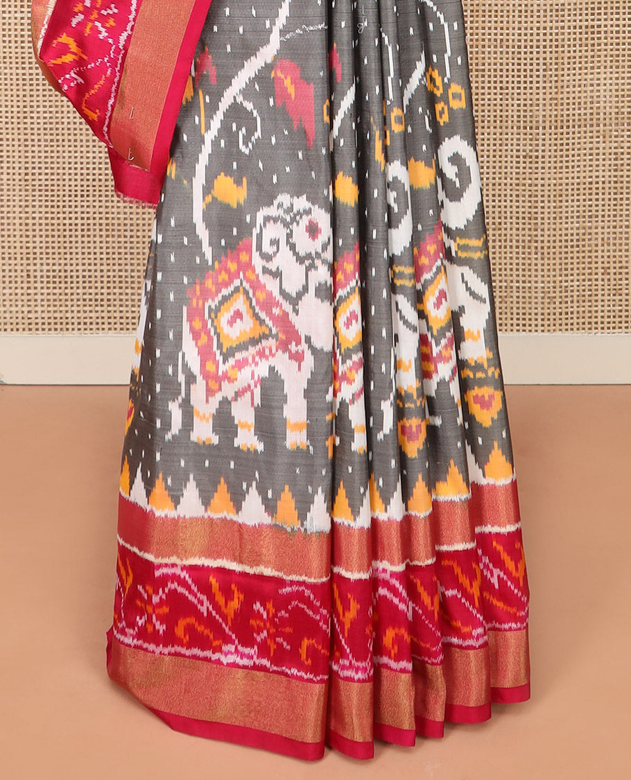 Grey Ikkat Silk Saree Decked Up with Elephant Motifs in Ikkat Weave, Complemented by a Contrast Temple Border, Pallu Woven in Intricate Ikkat Designs, and a Contrast Blouse