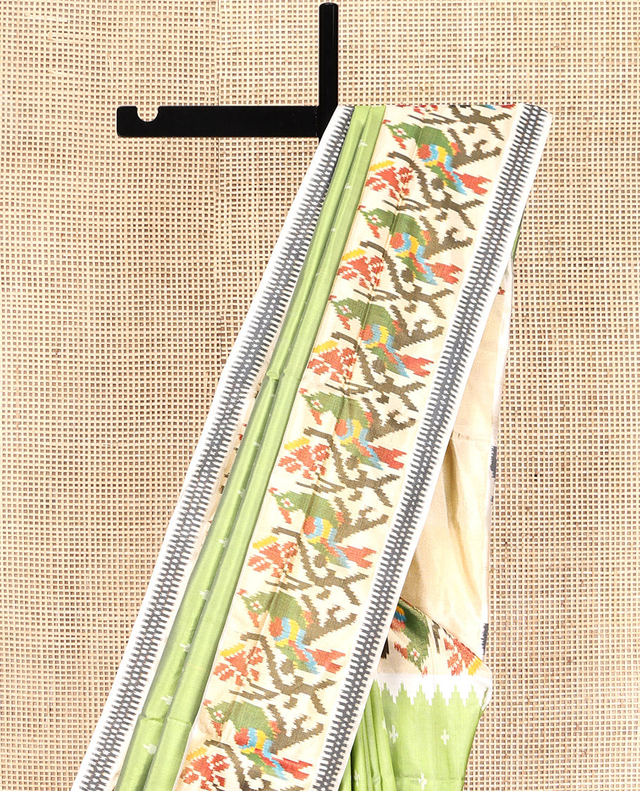 Green Pochampally Ikat Silk Saree, Steeped with Ikkat Buttas on Its Body, Complemented by a Contrast Temple Border of Paithani-Style Floral-Peacock Designs, Pallu of Same Design, and Paired with a Contrast Blouse