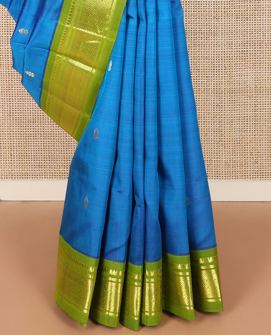 Blue zari buttas kanchipuram silk saree, contrast korvai border of thilakam mokku, banaras, and jaal designs, and zari design pallu