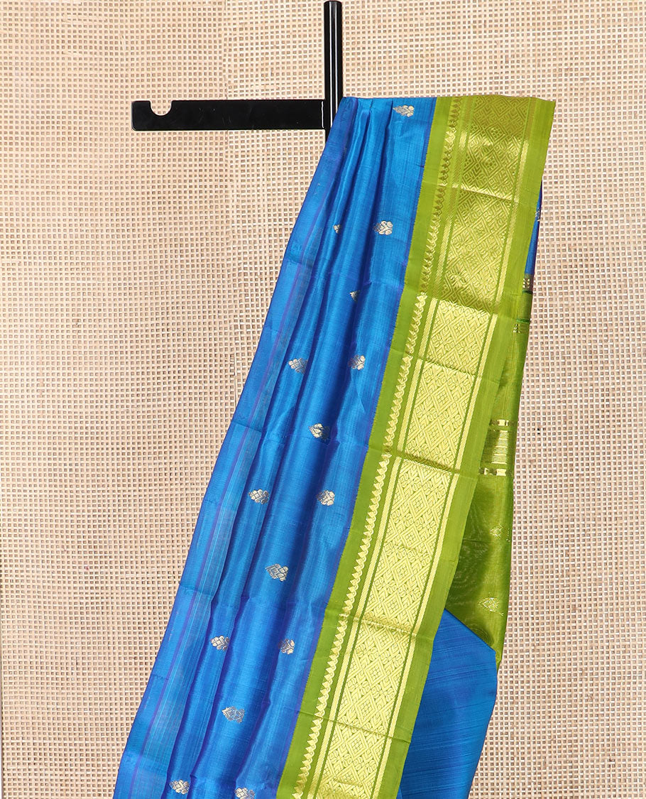Blue zari buttas kanchipuram silk saree, contrast korvai border of thilakam mokku, banaras, and jaal designs, and zari design pallu