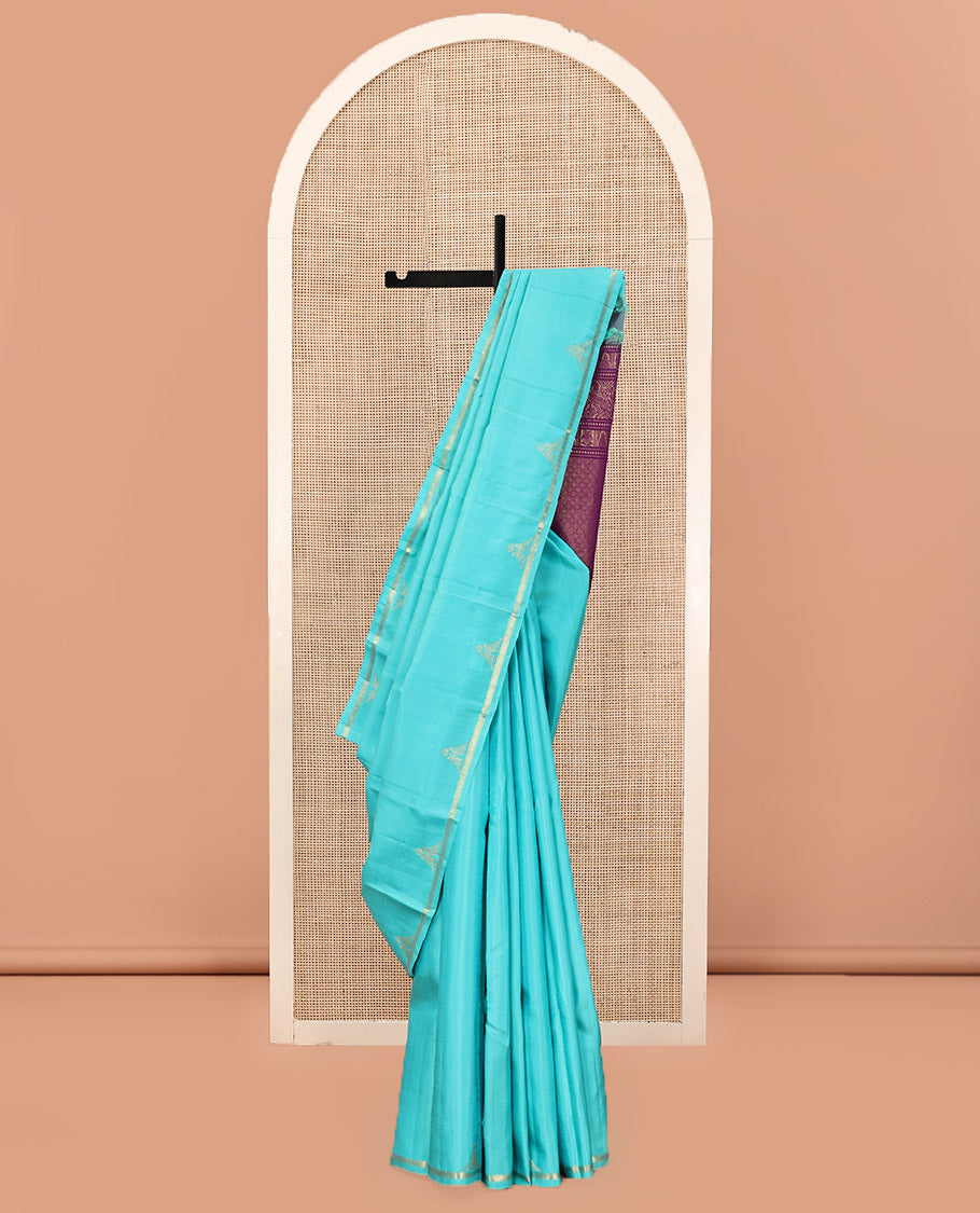 Blue Plain Kanchipuram Silk Saree, Subtle Zari Border of Muthu, Vanki, and Kili Designs, Captivating Contrast Pallu of Thilakam Mokku, Thazampoo Rekku, Iruthalai Pakshi, Kuthirai, and Jaal Designs, and Paired with a Contrast Blouse