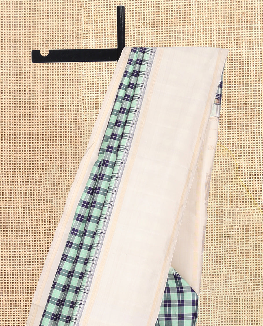 Green-Blue Checked Kanchipuram Silk Saree, Complemented by a Contrast Thazampoo Rekku Bodi Border, Sparsely Woven Pallu, and Contrast Blouse
