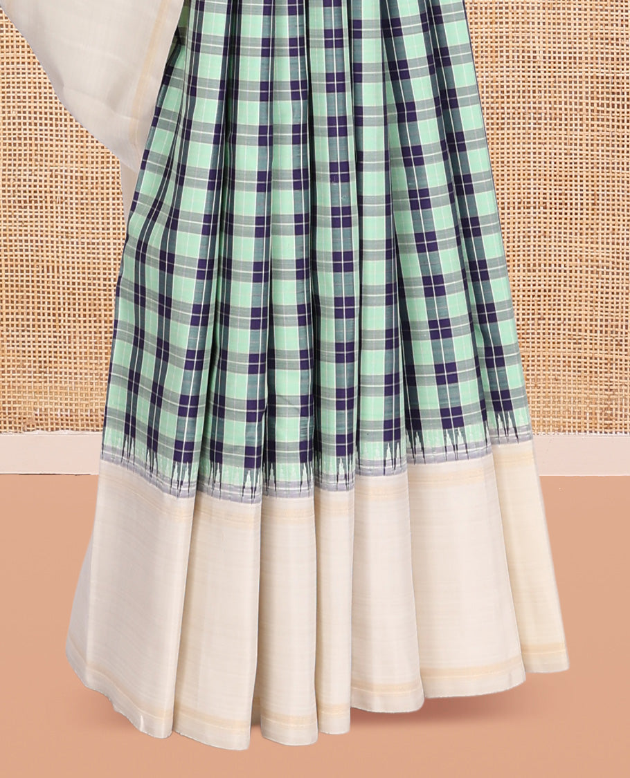 Green-Blue Checked Kanchipuram Silk Saree, Complemented by a Contrast Thazampoo Rekku Bodi Border, Sparsely Woven Pallu, and Contrast Blouse