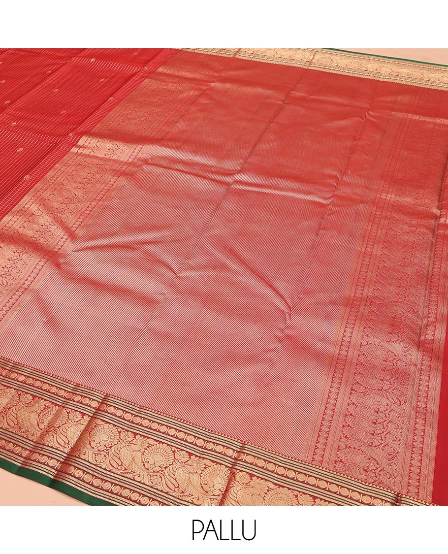 Red Kanchipuram Silk Saree, Richly Detailed with Zari Butta Enclosed Checks on Its Body, Highlighted by Zari Border of Rekku, Poun, Banaras, and Mayil Kann Designs, Diagonally Striped Pallu, and Paired with a Contrast Blouse
