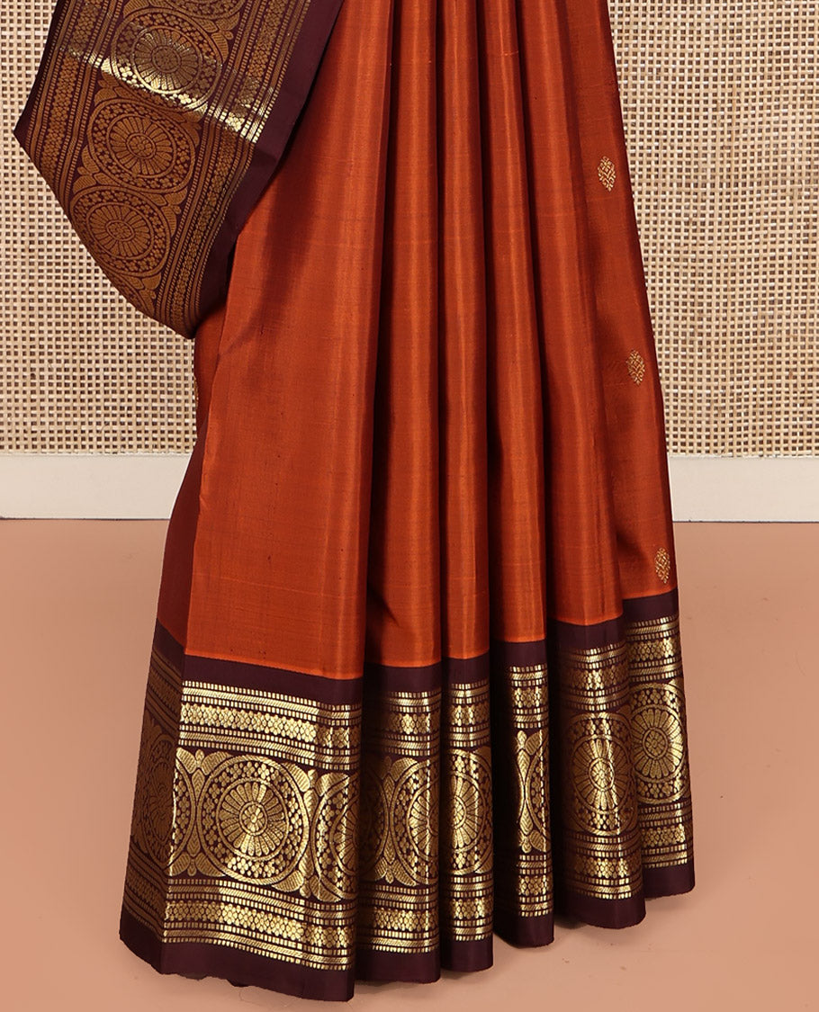 Orange Kanchipuram Silk Saree, Showcasing Zari Buttas All Over Its Body, Complemented by a Contrast Border of Muthu, Kathir, Kamalam, and Chakram Designs, Grand Jaal Pallu, and Paired with a Contrast Blouse