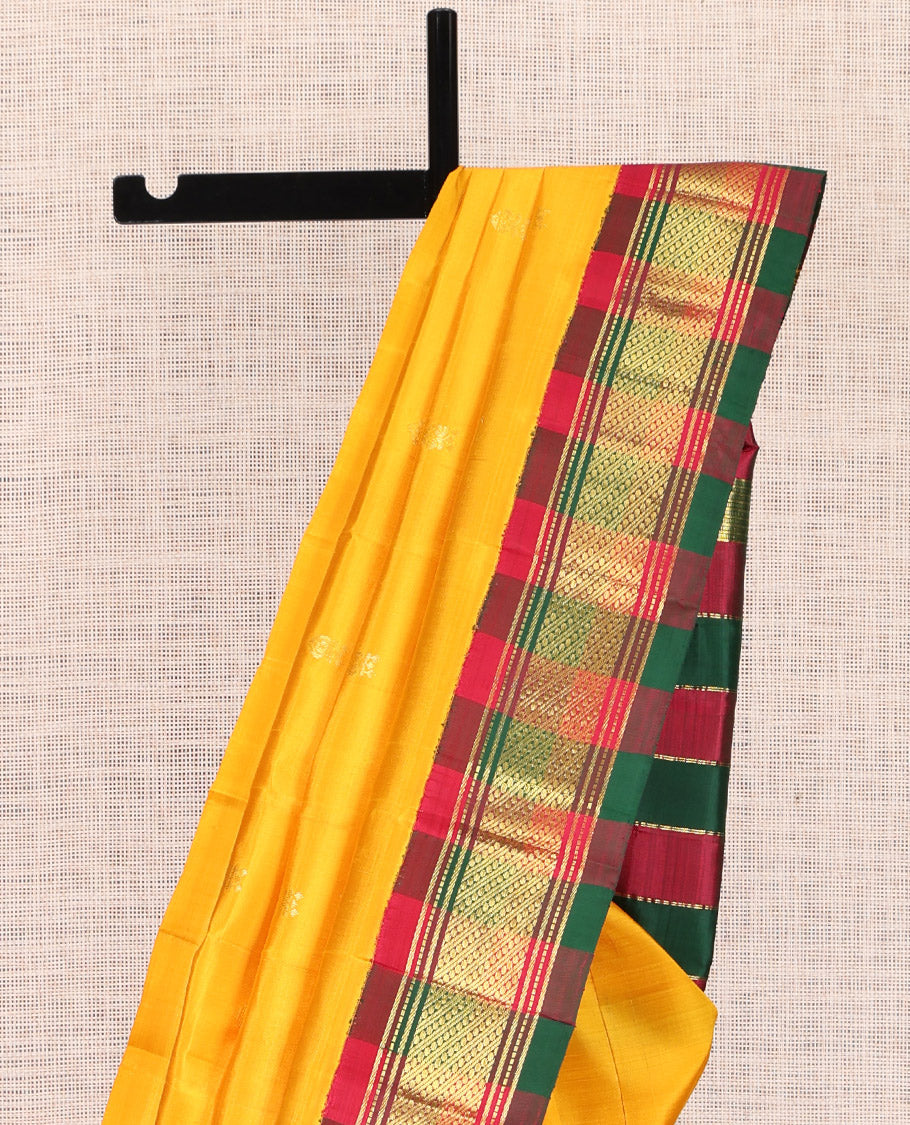 Yellow Kanchipuram Silk Saree, Woven with Zari Buttas, a Contrast One-sided Korvai Traditional Border, Pallu of Zari Designs, and No Blouse
