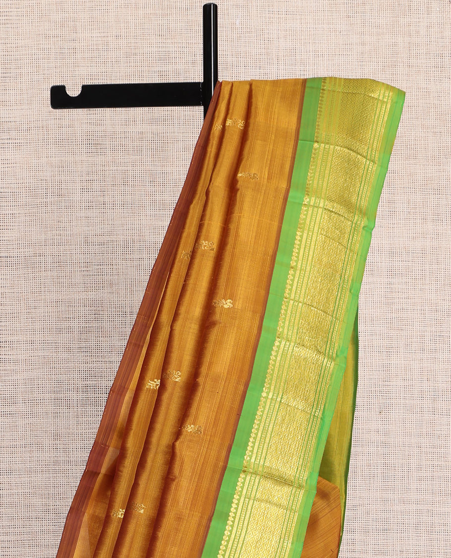 Mustard Kanchipuram Silk Saree, Elevated with Zari Buttas, a Contrast One-Sided Border of Rekku, Banaras, Muthu, and Mayil Design, Zari Design Pallu, and No Blouse