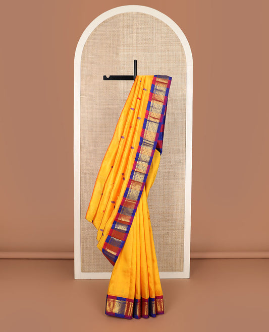 Yellow buttas Kanchipuram silk saree, contrast korvai border of thilakam mokku, banaras & jaal design & pallu of zari design