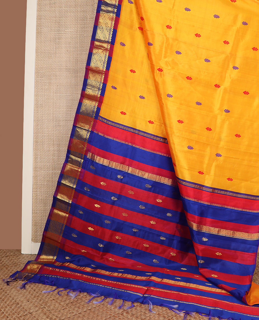 Yellow buttas Kanchipuram silk saree, contrast korvai border of thilakam mokku, banaras & jaal design & pallu of zari design