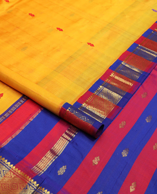 Yellow buttas Kanchipuram silk saree, contrast korvai border of thilakam mokku, banaras & jaal design & pallu of zari design