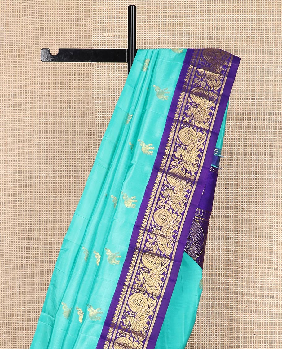 Blue fauna motifs silk saree, contrast one-sided korvai border of thilakam mokku, banaras & mayil designs & pallu steeped with mayil designs