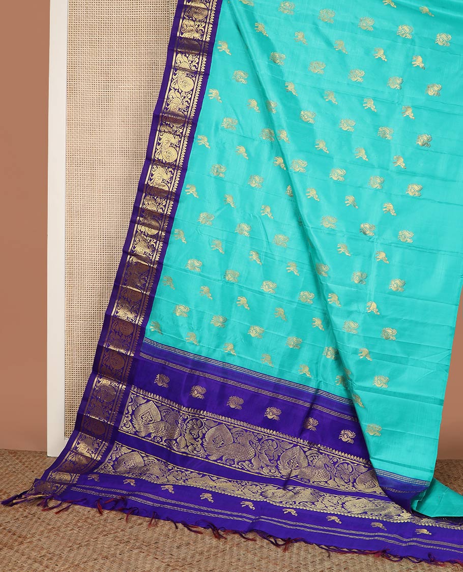 Blue fauna motifs silk saree, contrast one-sided korvai border of thilakam mokku, banaras & mayil designs & pallu steeped with mayil designs