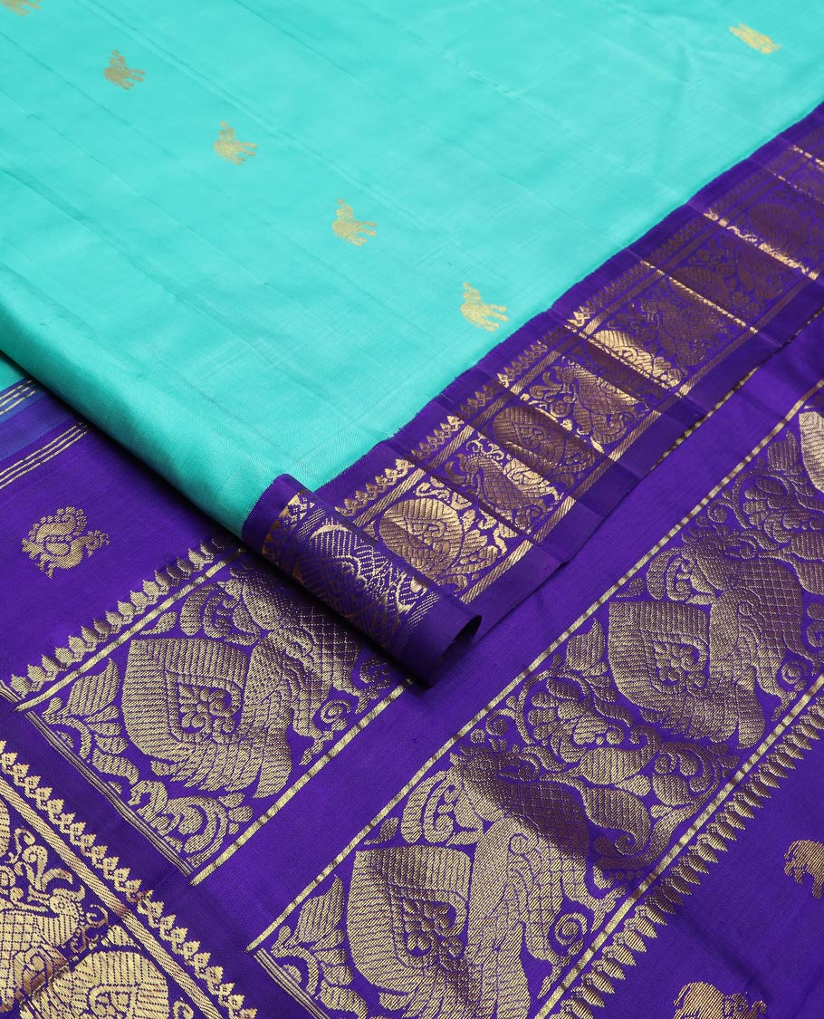 Blue fauna motifs silk saree, contrast one-sided korvai border of thilakam mokku, banaras & mayil designs & pallu steeped with mayil designs