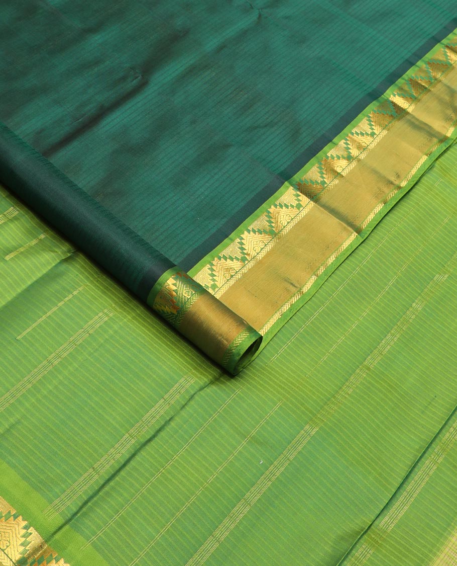 Green striped Kanchipuram silk saree, contrast rettai pettu border of thazampoo rekku, and kathir designs, and zari striped pallu