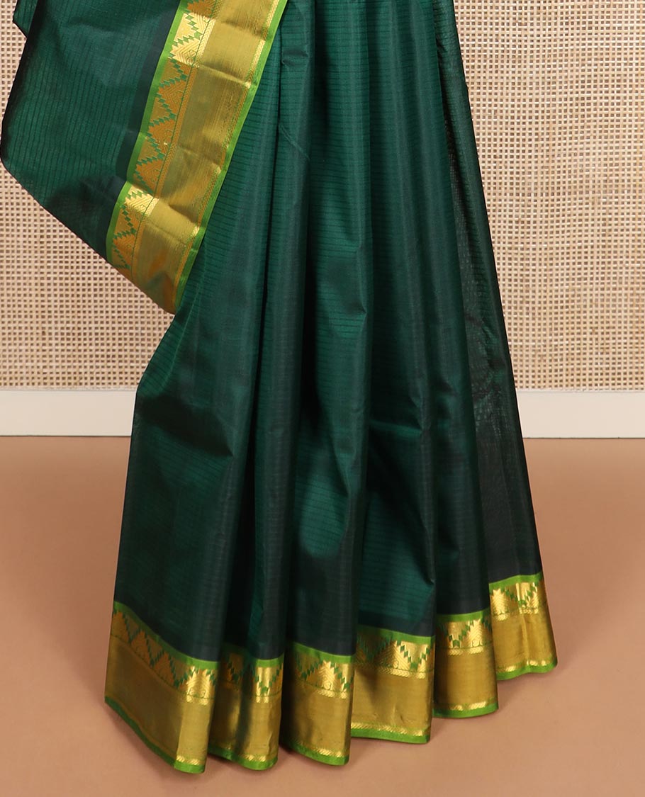 Green striped Kanchipuram silk saree, contrast rettai pettu border of thazampoo rekku, and kathir designs, and zari striped pallu