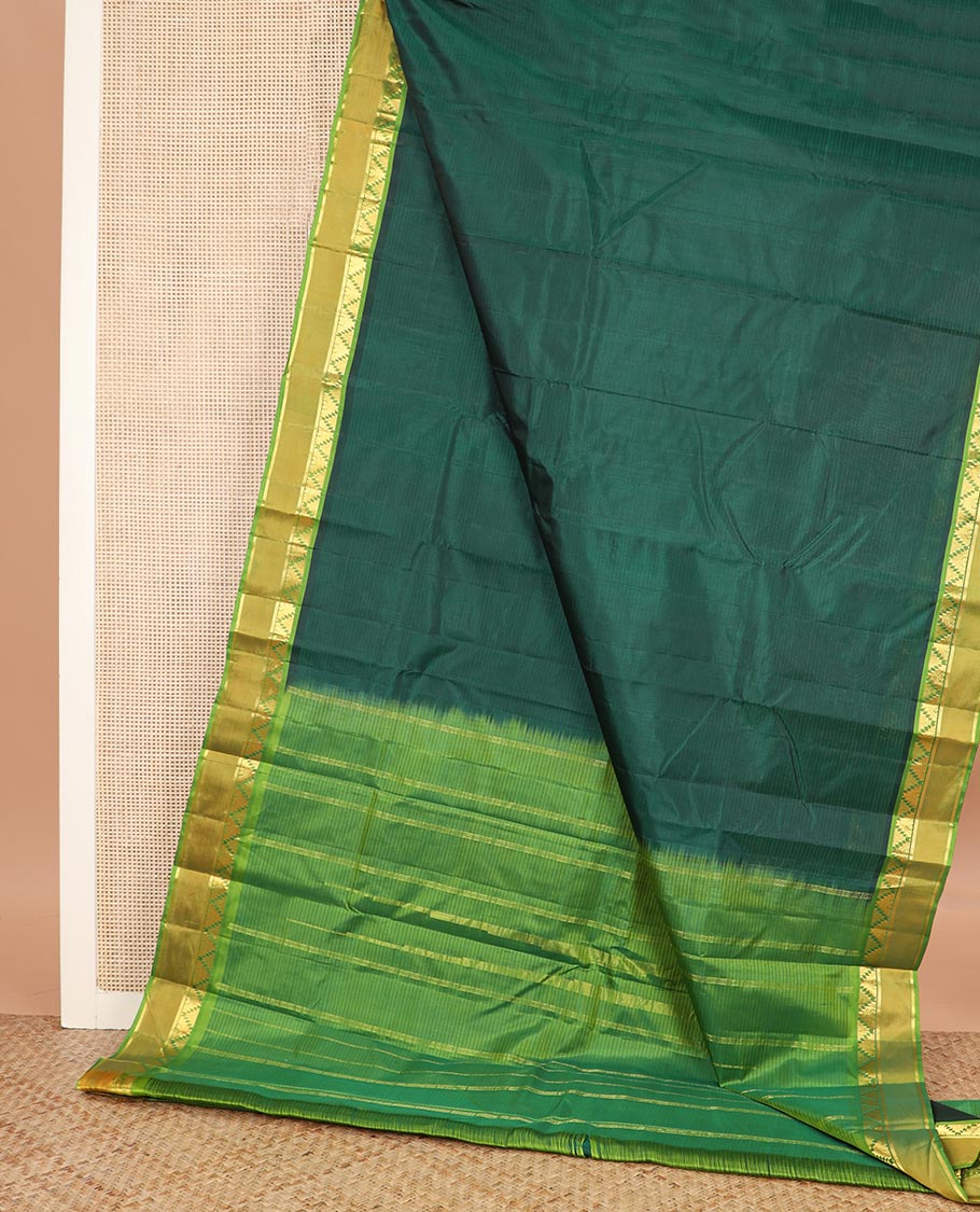 Green striped Kanchipuram silk saree, contrast rettai pettu border of thazampoo rekku, and kathir designs, and zari striped pallu