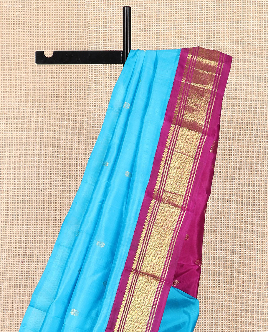 Blue zari buttas Kanchipuram silk saree, contrast korvai border of thilakam mokku, banaras, and jaal designs, and zari design pallu