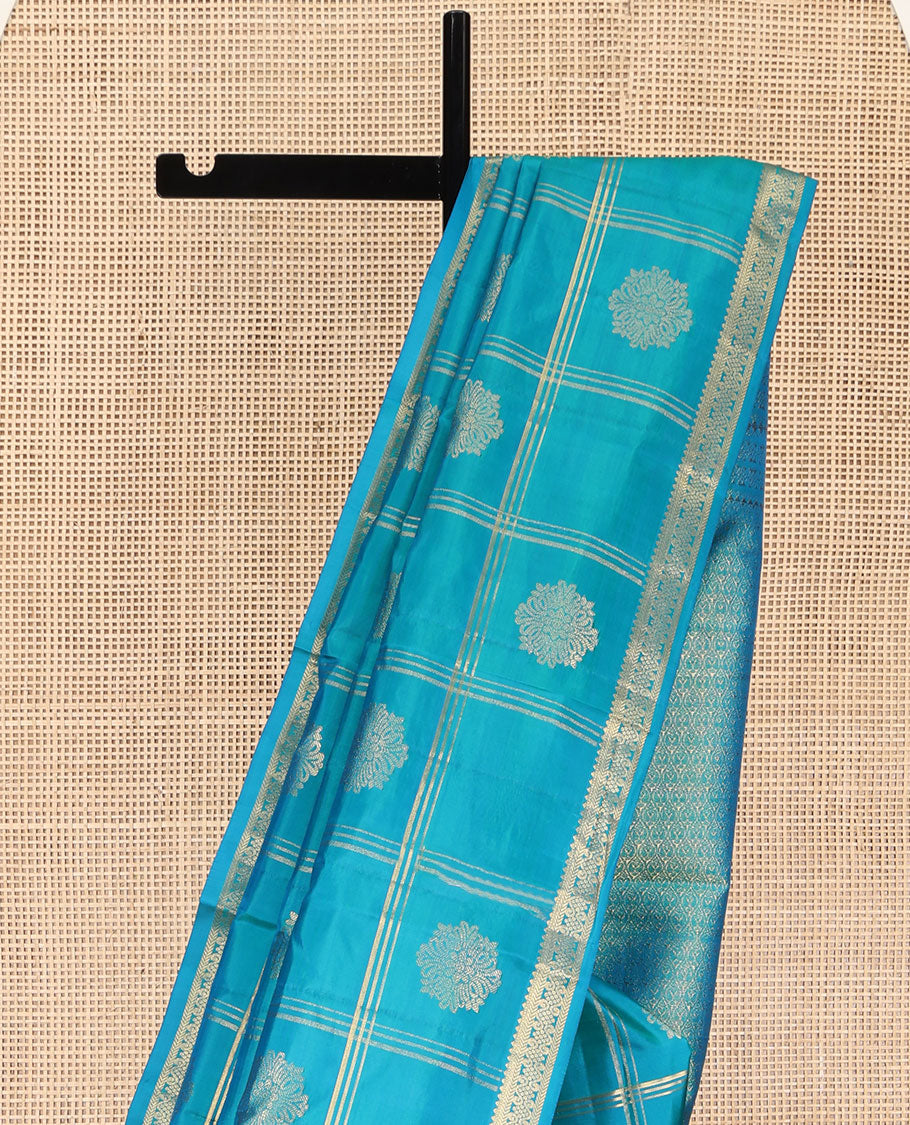 Blue Kanchipuram Silk Saree, Enriched with Zari Butta Enclosed Checked Design All Over Its Body, Subtly Zari-Woven Border, Grand Jaal Design Pallu, and Paired with a Matching Blouse