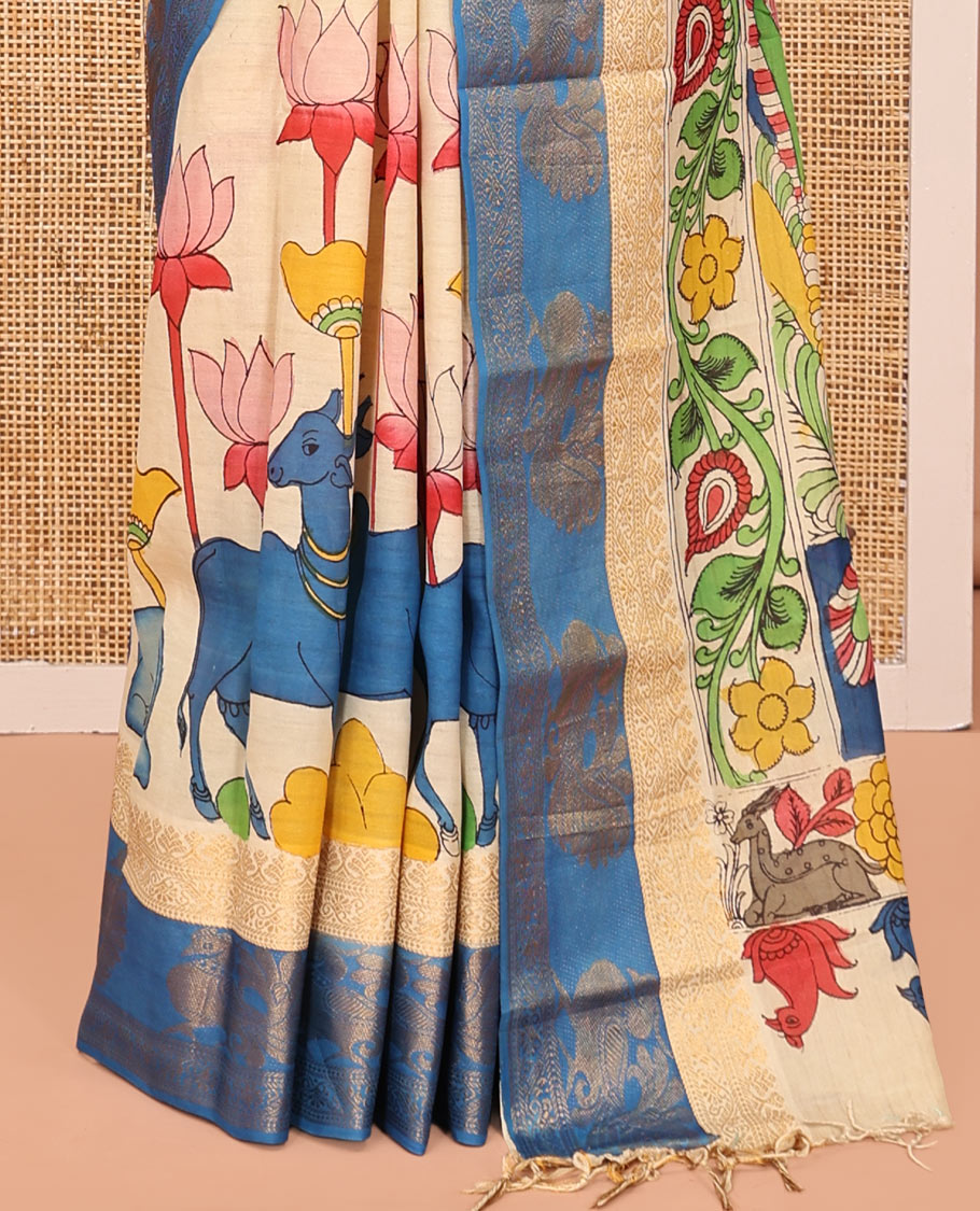 Sandal Kalamkari Printed Semi-Banarasi Tussar Saree, Beautified with Pichwai Cow-Lotus, Contrast Traditional Border, Contrast Peacock Printed Pallu, and a Contrast Blouse