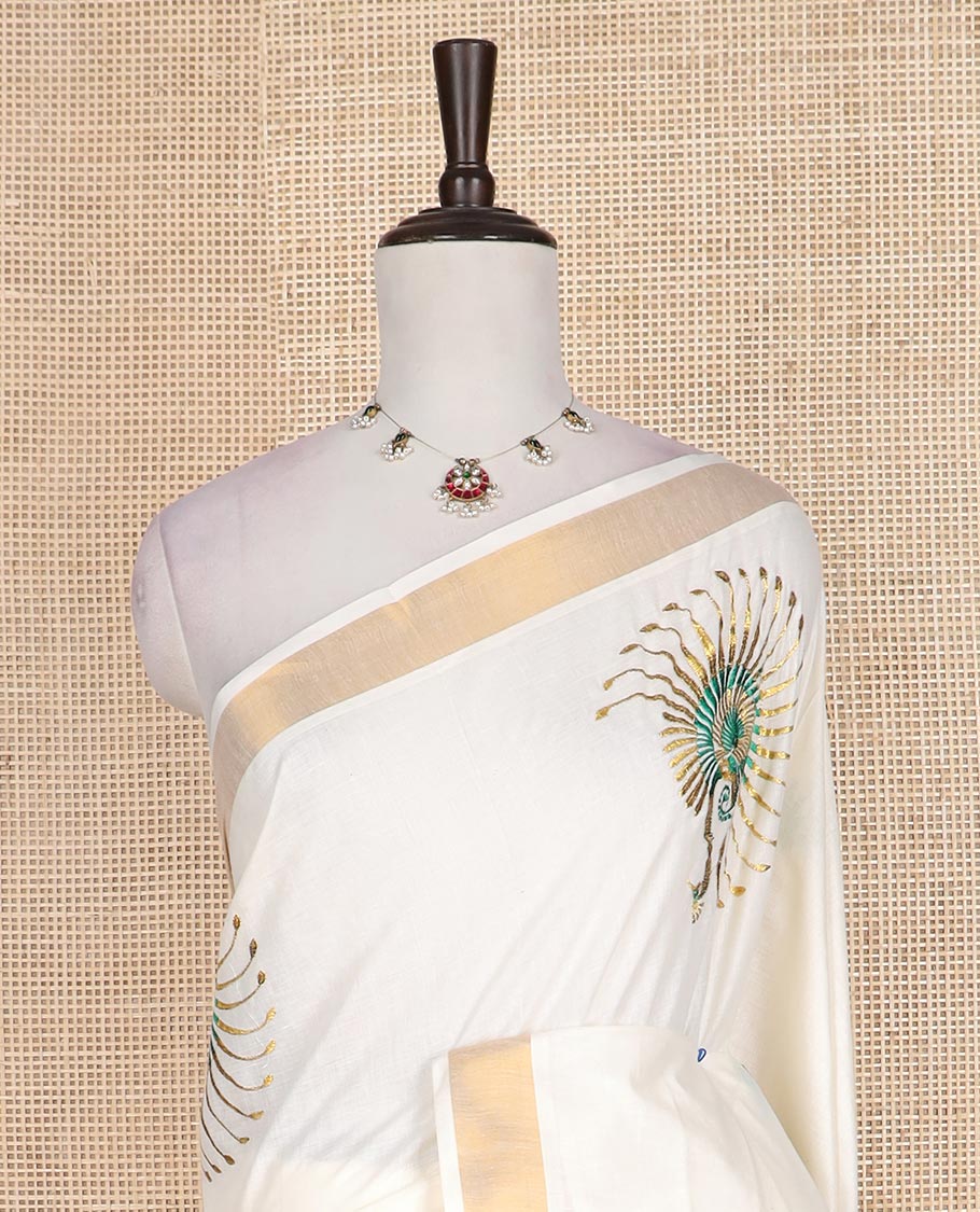 Cream peacock motifs embroidered Kerala cotton saree, bavanji border, and peacock embroidered pallu