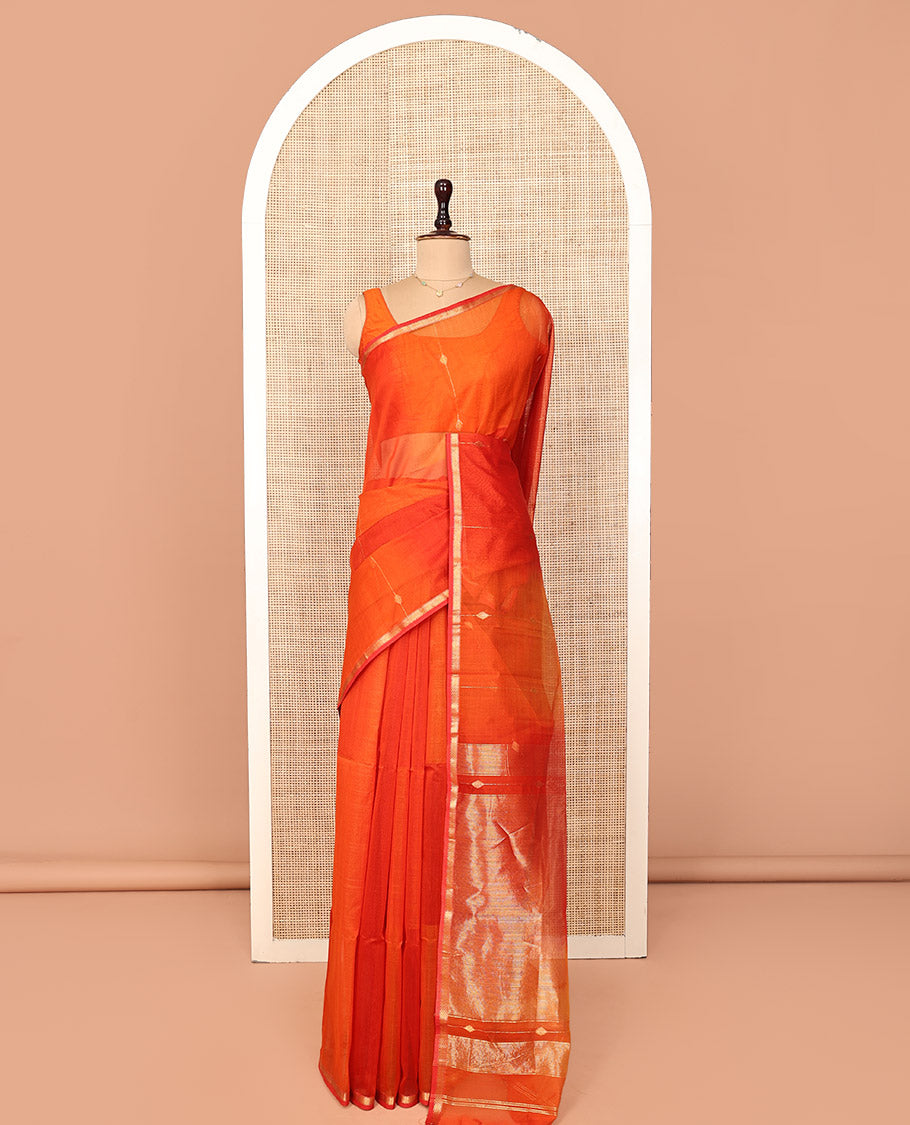 Orange Maheshwari Cotton Saree, Delicately Woven with Diamond Stripes on Its Body, Highlighted by Zari Border of Chevron Designs, Gleaming Pallu Steeped with Zari Stripes, and Paired with a Matching Blouse