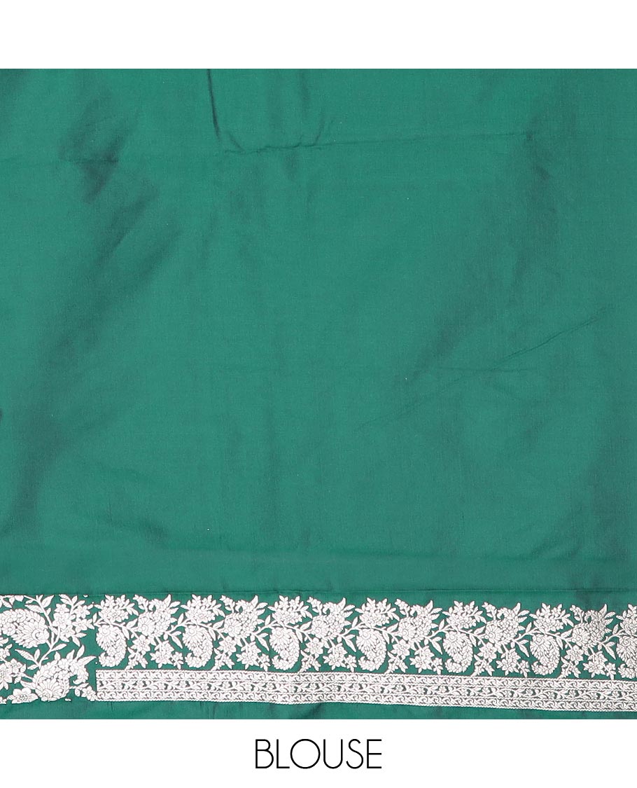 Green buttas mushru silk saree, self-border of floral-paisley creeper designs, and paisley design pallu