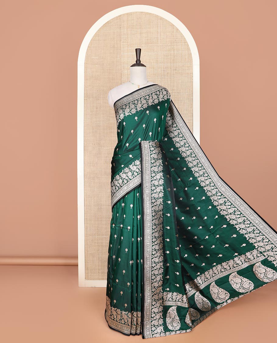 Green buttas mushru silk saree, self-border of floral-paisley creeper designs, and paisley design pallu
