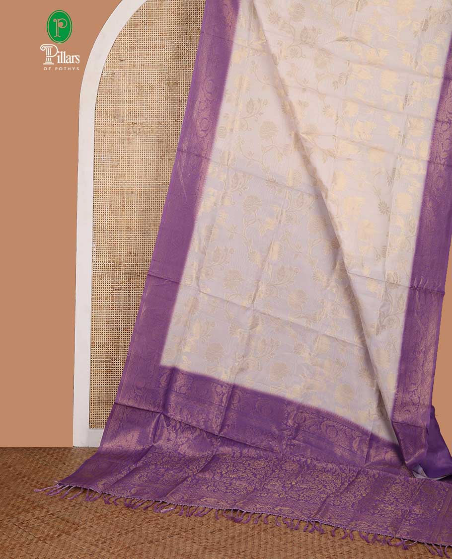 Cream with violet zari jall weaving design banaras brasso saree with contrast jacquard border & weaving pallu along with butta design blouse