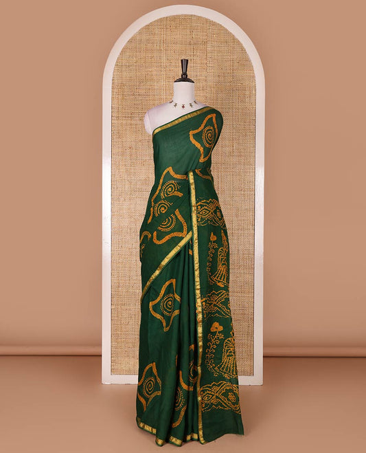 Green batik geometric printed pure cotton saree, zari piping border, human figurines batik printed pallu, and a matching batik printed blouse