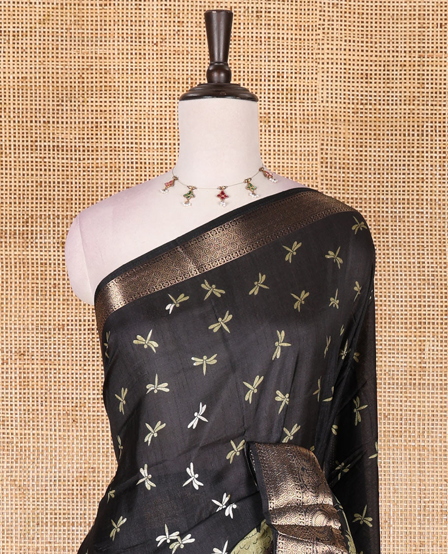 Black-green dargon fly and cranes motifs printed dola silk saree, contrast gold zari border, Mughal floral printed pallu, and dragon fly printed blouse