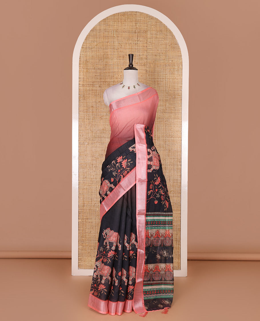 Black 2D style dyed and elephant-floral theme printed linen cotton saree, contrast zari bavanji border, intricately printed pallu, and contrast printed blouse