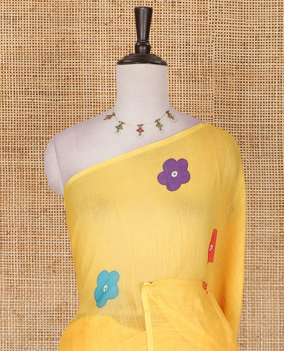 Borderless Yellow colorful five-petal flower motifs printed linen cotton saree, multi-color striped pallu, and contrast printed blouse