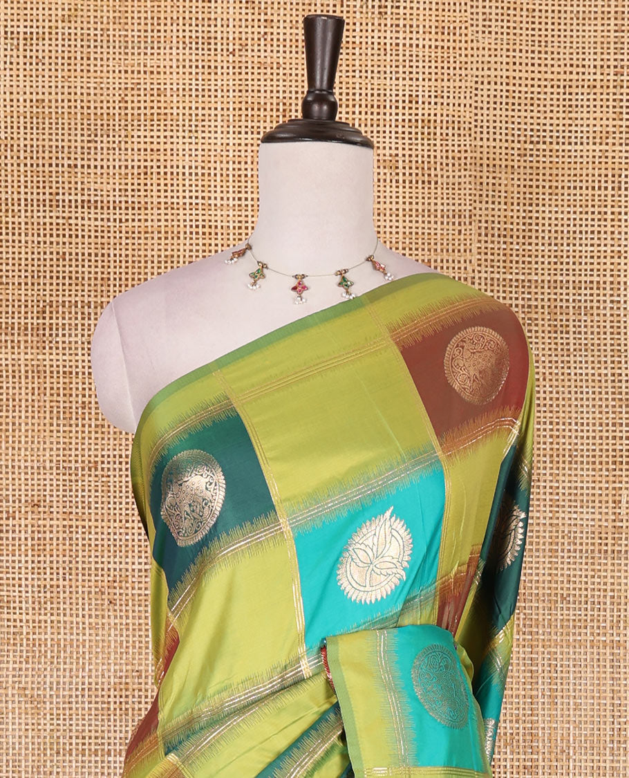 Borderless green chakra buttas enclosed, checked elite soft silk saree, contrast ogee patterned pallu, and contrast zari design blouse