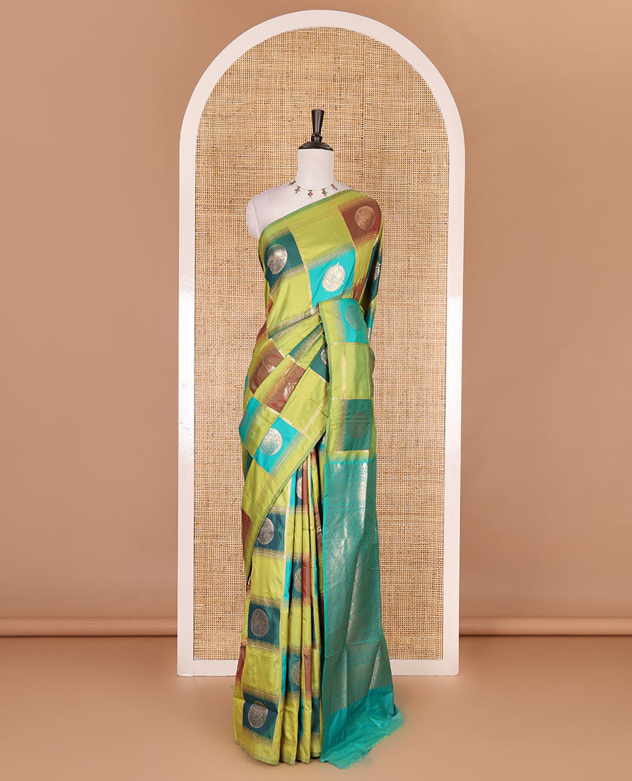 Borderless green chakra buttas enclosed, checked elite soft silk saree, contrast ogee patterned pallu, and contrast zari design blouse