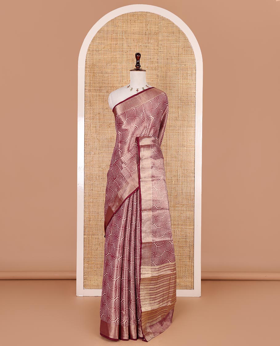 Wine scallop design tissue saree, zari striped border, striped pallu, and gleaming matching blouse