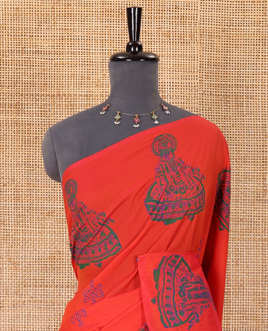 Borderless orange kolam and kathakali motifs printed South cotton saree with a matching blouse, and a contrast floral vine printed blouse