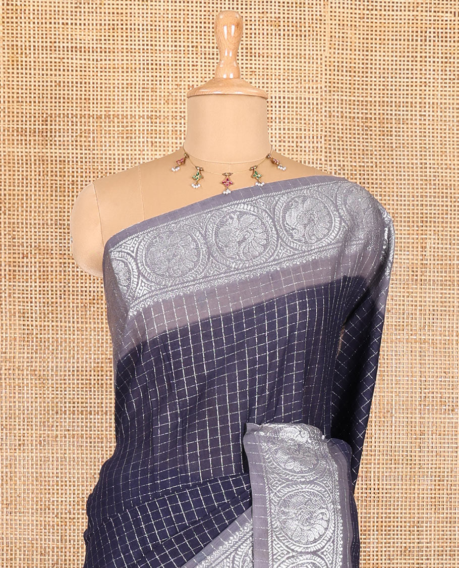 Navy blue and grey checked sungudi cotton saree, contrast silver zari round peacock border, striped pallu, and a contrast checked blouse